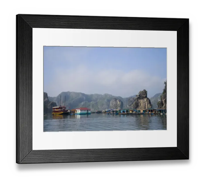 Framed Print : Floating Vietnamese fishing village with rocky coastline