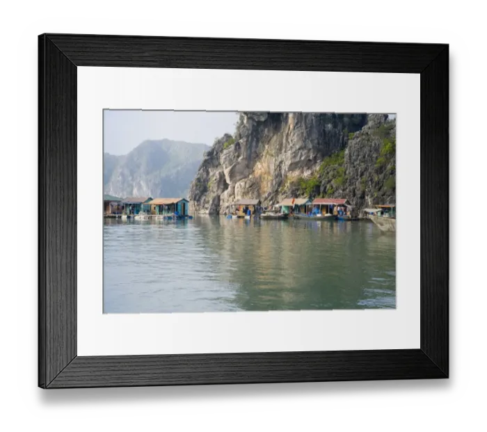 Framed Print : Floating Vietnamese fishing village at base of cliff Framed Print : Floating Vietnamese fishing village at base of cliff