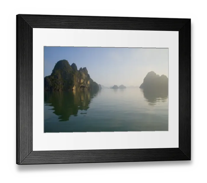 Framed Print : Rocky islands with still water in misty morning Framed Print : Rocky islands with still water in misty morning