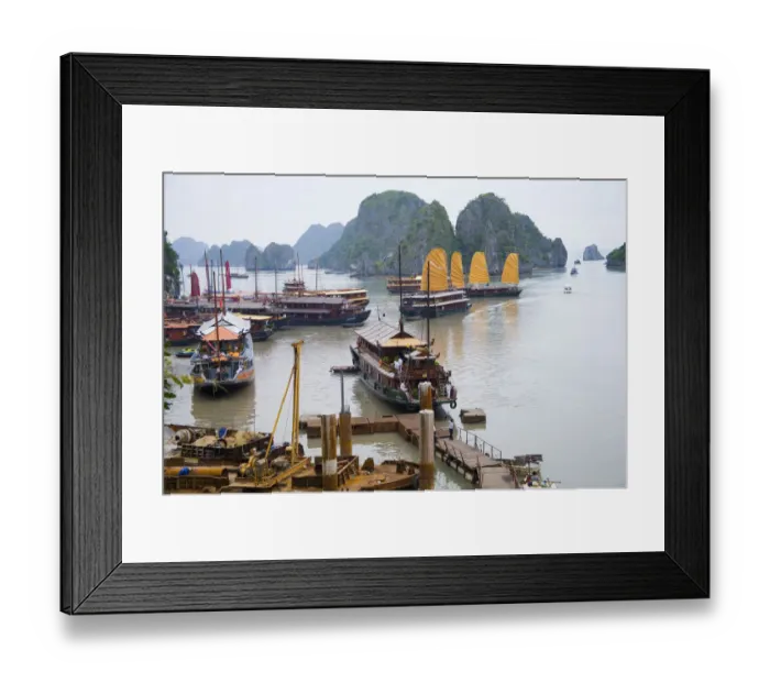 Framed Print : Boats and rocky islands in Vietnamese harbor