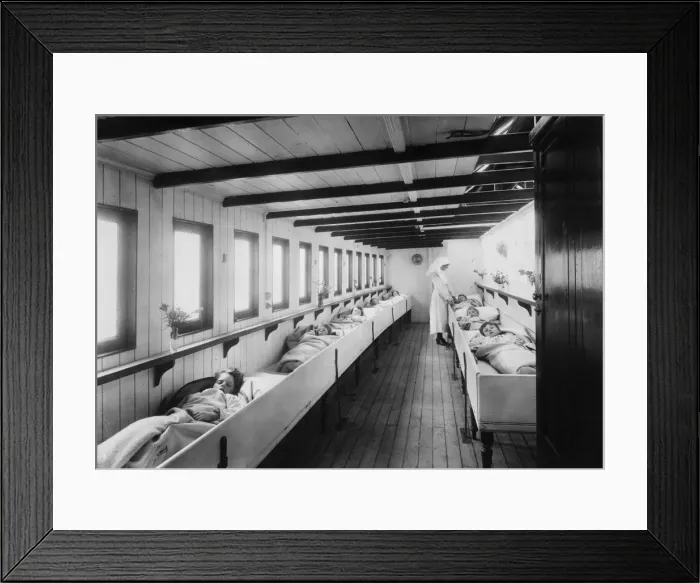 Framed Print : Keep Away. A nurse tends to young patients in a river ambulance for sufferers Framed Print : Keep Away. A nurse tends to young patients in a river ambulance for sufferers