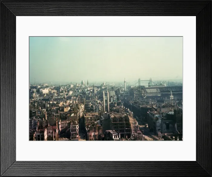 Framed Print : Bomb Site. circa 1940: A heap of rubble and the shell of a house in the Framed Print : Bomb Site. circa 1940: A heap of rubble and the shell of a house in the