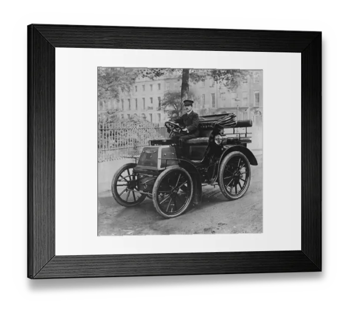Framed Print : Kings Car. circa 1906: A chauffeur sitting at the wheel of the first car Framed Print : Kings Car. circa 1906: A chauffeur sitting at the wheel of the first car