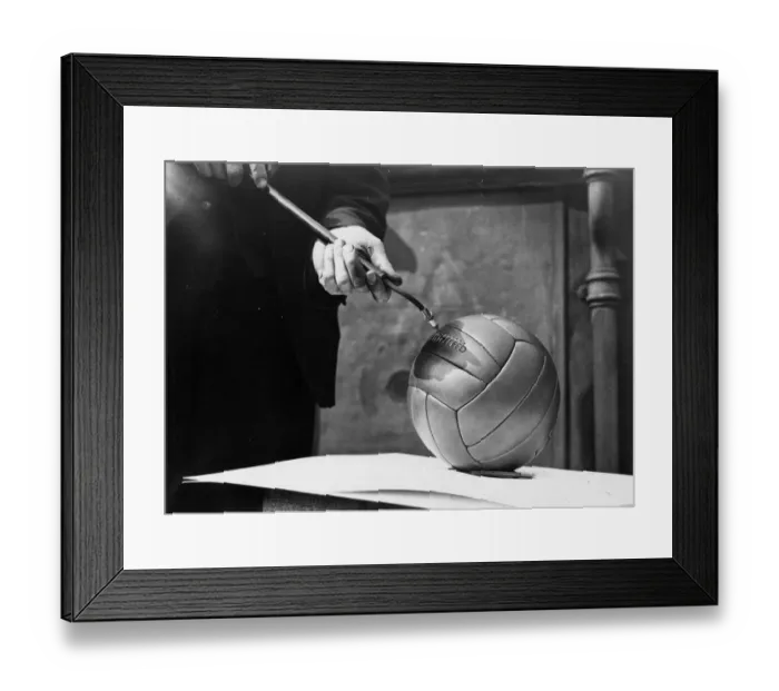 Framed Print : Inflating A Football Framed Print : Inflating A Football