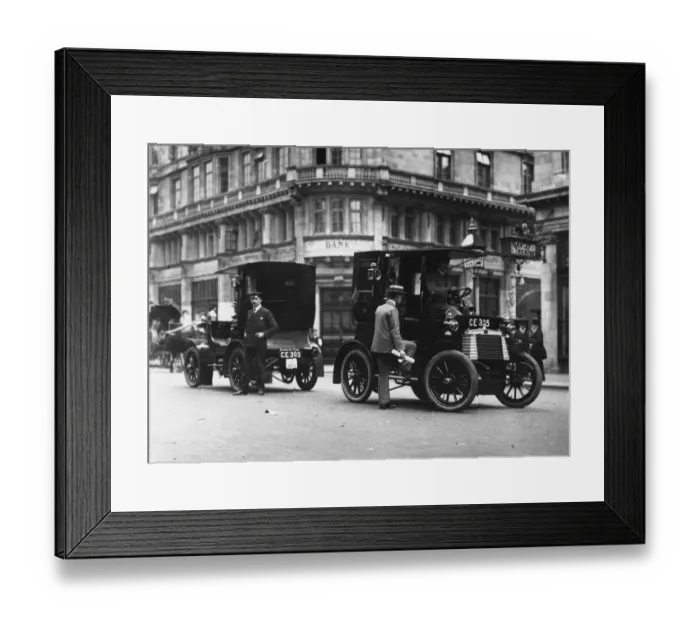 Framed Print : Early Cab. circa 1906: A passenger entering a taxicab outside the Savoy Theatre, London