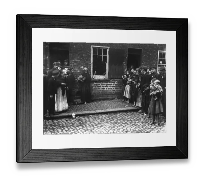 Framed Print : A crowd inspects damage to a house by a regiment of soldiers at Donegal Quay