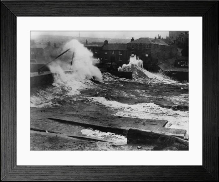 Framed Print : High Seas. circa 1925: Huge waves destroying the harbour wall in Porthleven, Cornwall Framed Print : High Seas. circa 1925: Huge waves destroying the harbour wall in Porthleven, Cornwall