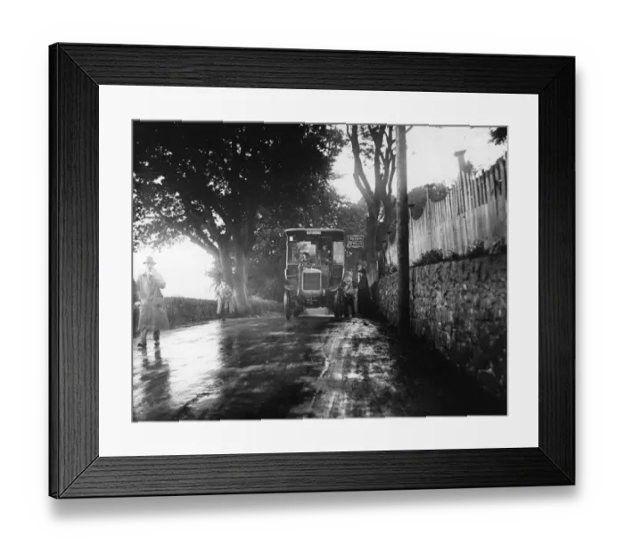 Framed Print : Bus Stop. 12th August 1912: A Railways bus stops to allow passengers to