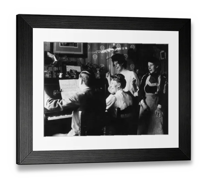 Framed Print : Sing-Song. 1908: A family have a sing-song round a piano Framed Print : Sing-Song. 1908: A family have a sing-song round a piano