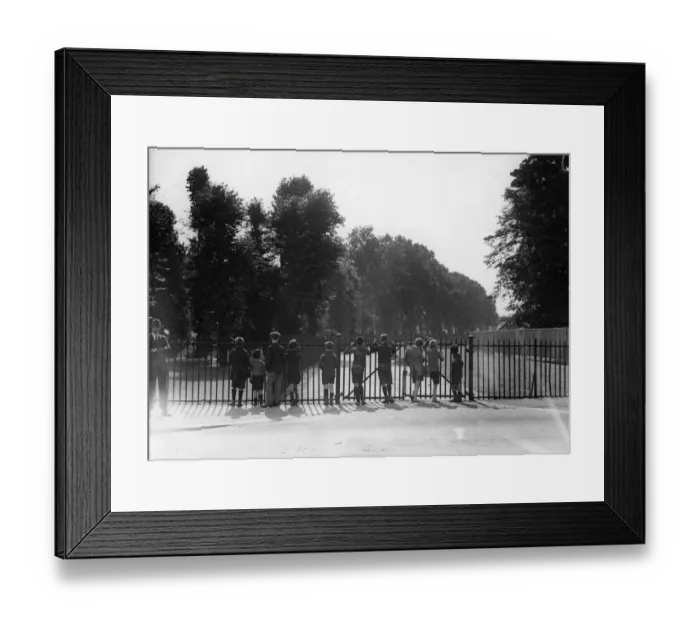 Framed Print : Park View. circa 1923: A group of young boys looking through the railings Framed Print : Park View. circa 1923: A group of young boys looking through the railings