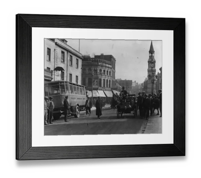 Framed Print : Cycle Car. circa 1921: A street scene: the car on the right is a cycle car Framed Print : Cycle Car. circa 1921: A street scene: the car on the right is a cycle car