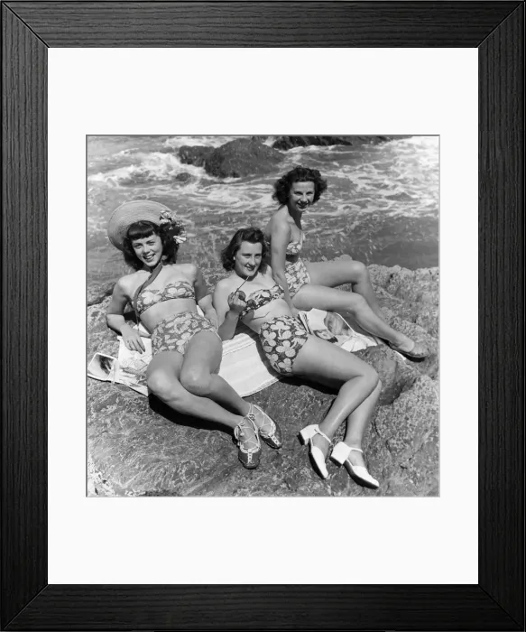 Framed Print : Three teenage girls (16-18) sunbathing on rocks, portrait (B&W) Framed Print : Three teenage girls (16-18) sunbathing on rocks, portrait (B&W)