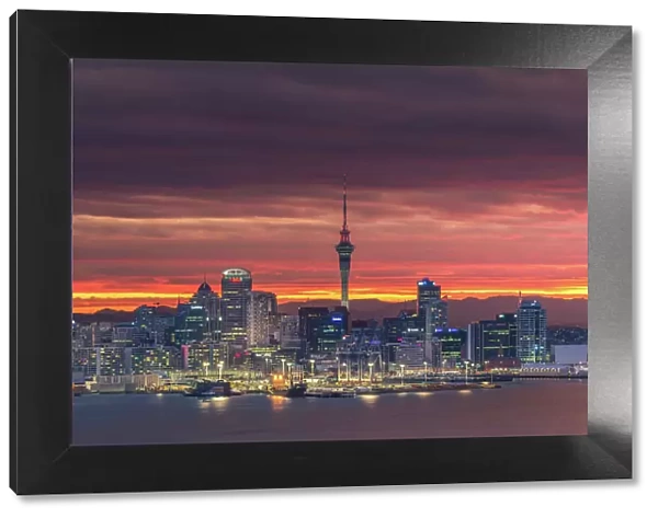 Colourful sky over Auckland city with city night light
