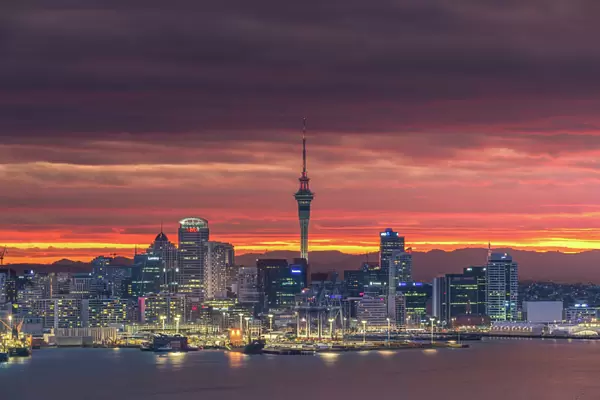 Colourful sky over Auckland city with city night light