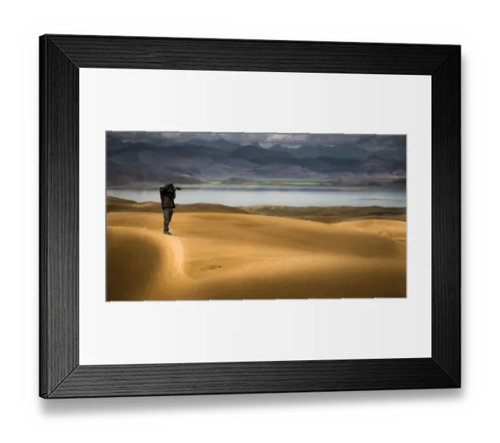 Framed Print : a man on a shooting post over a desert