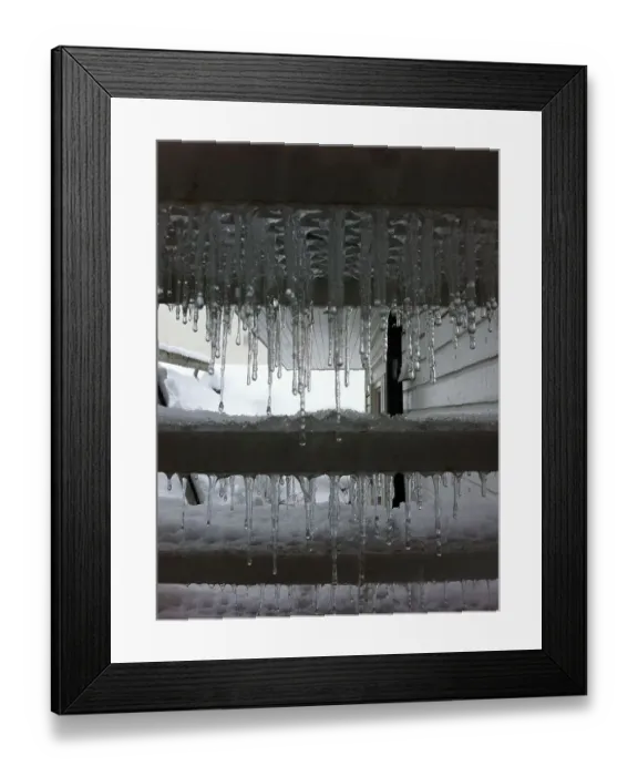 Framed Print : Cold Snap. Icicles coating the underside of stairs Framed Print : Cold Snap. Icicles coating the underside of stairs