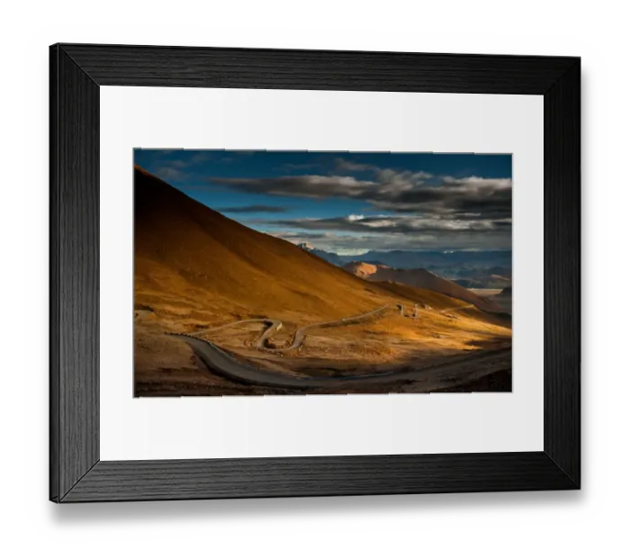 Framed Print : hill side meandering road on tibetan plateau