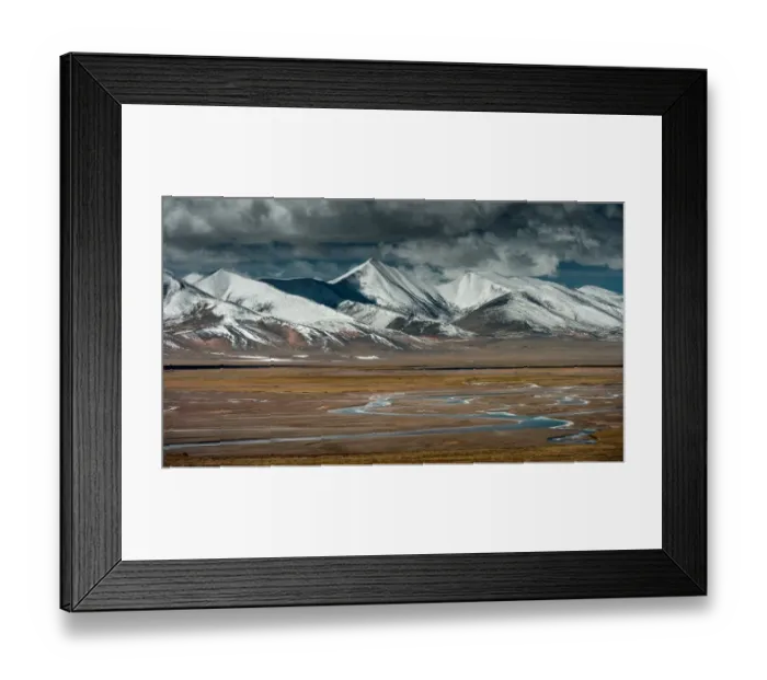 Framed Print : Tibet. Small creeks passing through Tibet highland with snow capped mountain in background Framed Print : Tibet. Small creeks passing through Tibet highland with snow capped mountain in background