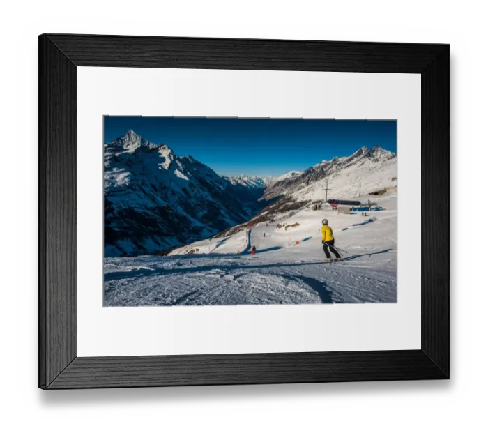 Framed Print : Ski track. People on ski track against snowy mountains Framed Print : Ski track. People on ski track against snowy mountains