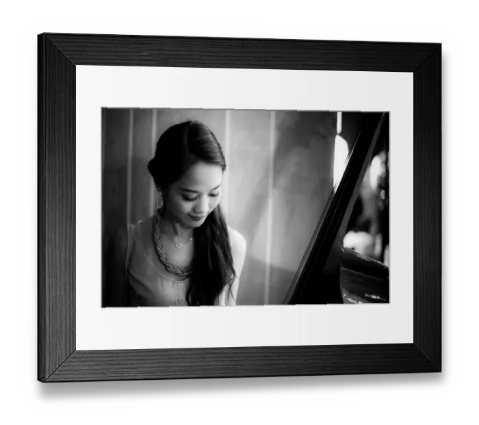 Framed Print : Young woman looking at a Cello