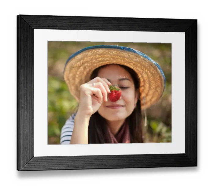 Framed Print : Woman with strawberry infront Framed Print : Woman with strawberry infront