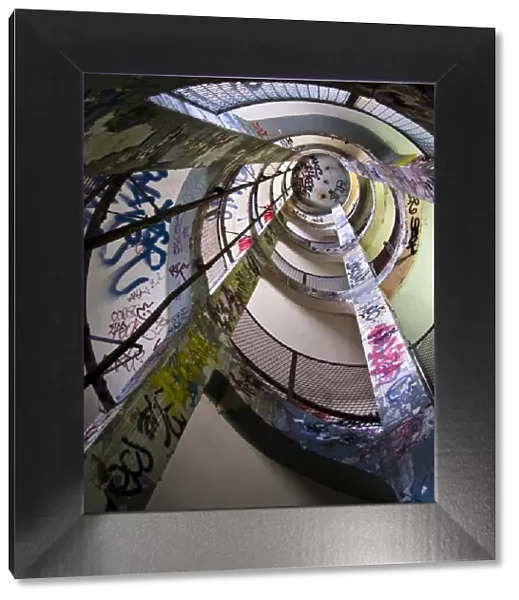 Frigos. Spiral staircase seen from above. Graffitti