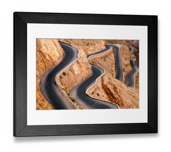 Framed Print : Winding road with hairpin bends up the rocky Atlas mountains from the Dades Valley, Morocco Framed Print : Winding road with hairpin bends up the rocky Atlas mountains from the Dades Valley, Morocco