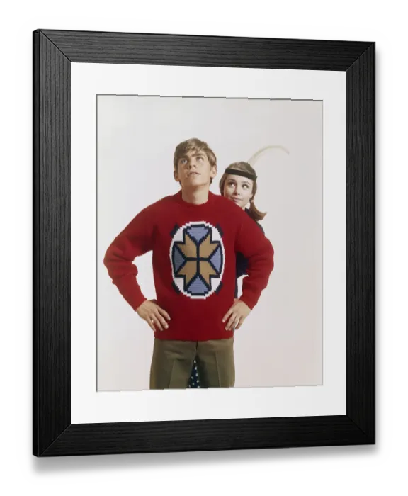 Framed Print : Young couple standing against white background Framed Print : Young couple standing against white background