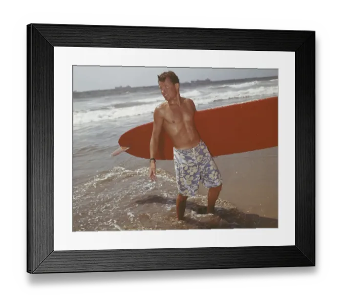 Framed Print : Young man holding surfboard on beach Framed Print : Young man holding surfboard on beach