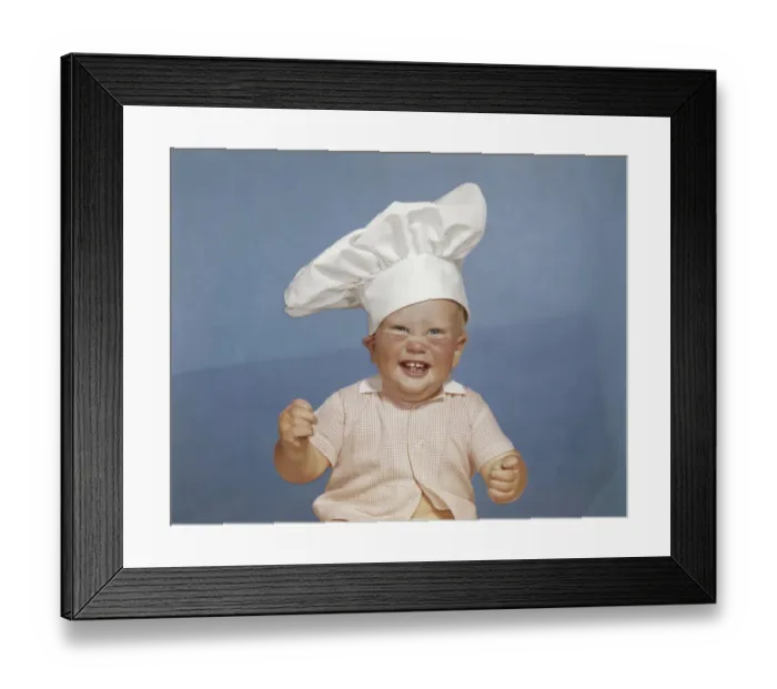 Framed Print : Baby boy wearing chefs hat, smiling, portrait Framed Print : Baby boy wearing chefs hat, smiling, portrait