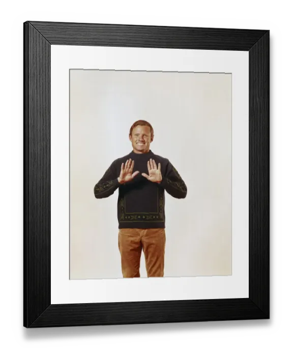 Framed Print : Man standing against white background, smiling, portrait Framed Print : Man standing against white background, smiling, portrait