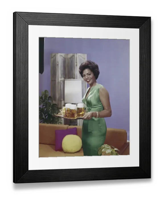 Framed Print : Woman holding tray with beer glasses, smiling, portrait Framed Print : Woman holding tray with beer glasses, smiling, portrait