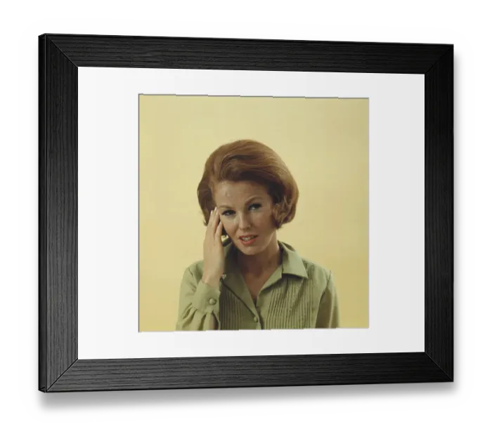 Framed Print : Woman rubbing temple, portrait