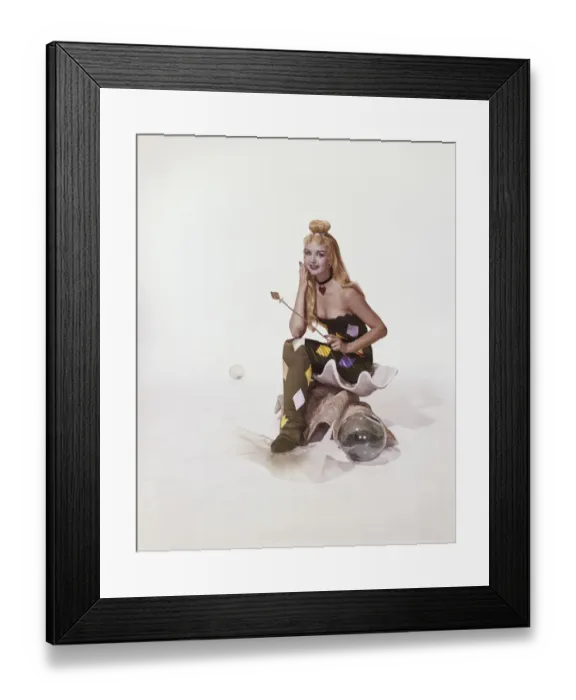 Framed Print : Young woman in mermaid costume sitting on shell, smiling, portrait Framed Print : Young woman in mermaid costume sitting on shell, smiling, portrait