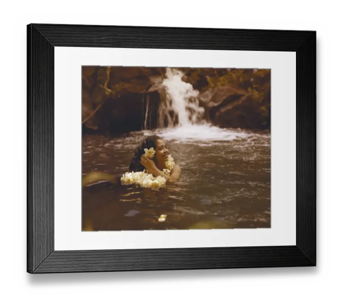 Framed Print : Young woman in water wearing garland and looking away Framed Print : Young woman in water wearing garland and looking away