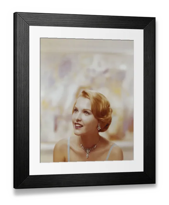 Framed Print : Young woman smiling, close-up Framed Print : Young woman smiling, close-up