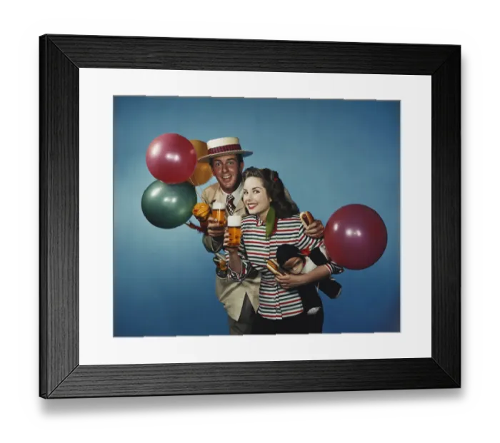 Framed Print : Man and woman with balloons and refreshments Framed Print : Man and woman with balloons and refreshments