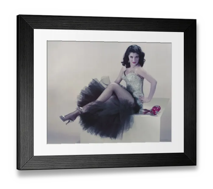 Framed Print : Young woman sitting on pedestal, smiling, portrait Framed Print : Young woman sitting on pedestal, smiling, portrait