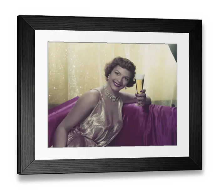 Framed Print : Woman sitting with glass of beer, portrait