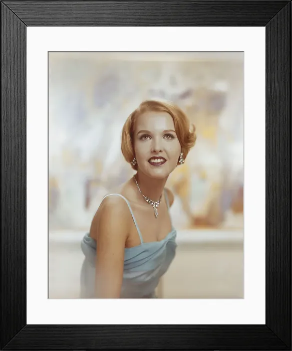 Framed Print : Young woman looking away, smiling Framed Print : Young woman looking away, smiling
