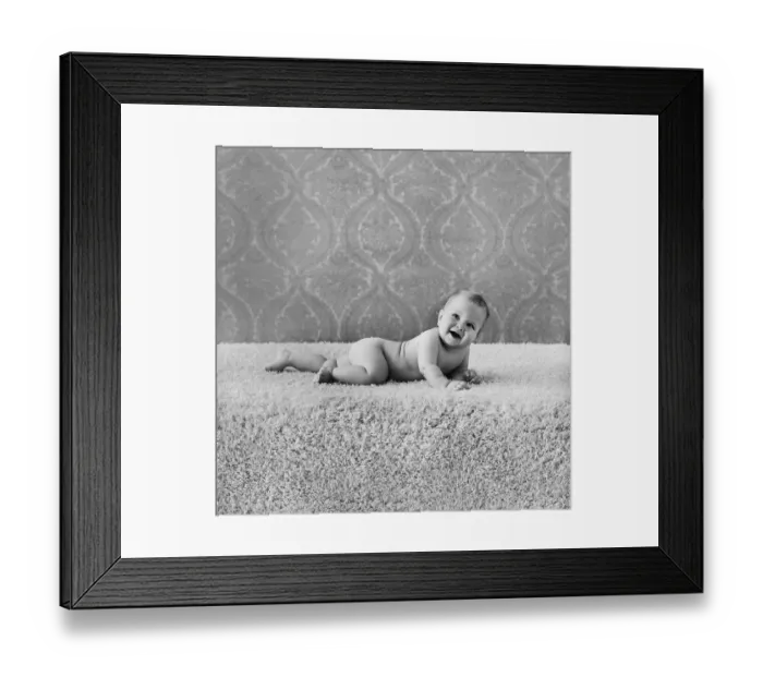 Framed Print : Baby boy lying on rug, smiling Framed Print : Baby boy lying on rug, smiling