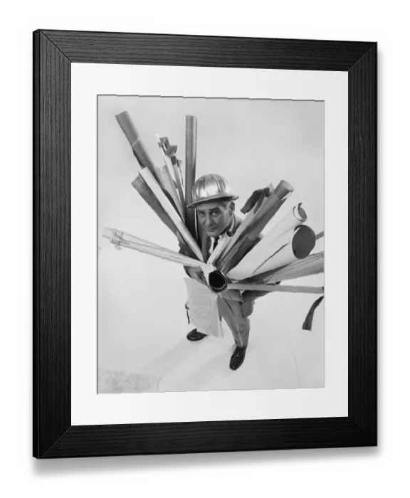 Framed Print : Architect holding blueprints, smiling, portrait