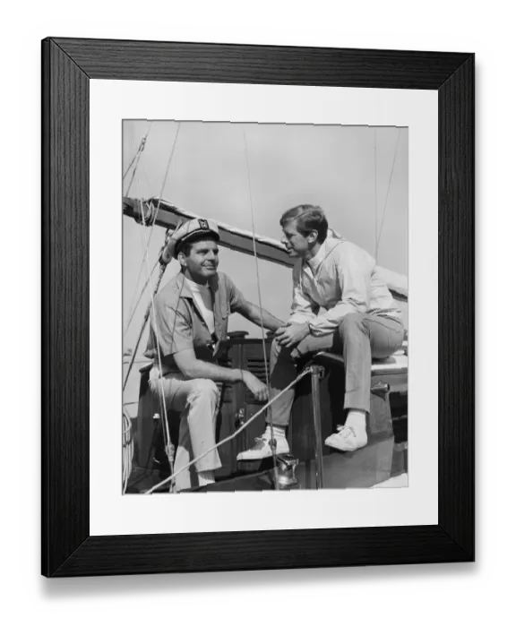 Framed Print : Two men talking in boat, smiling Framed Print : Two men talking in boat, smiling