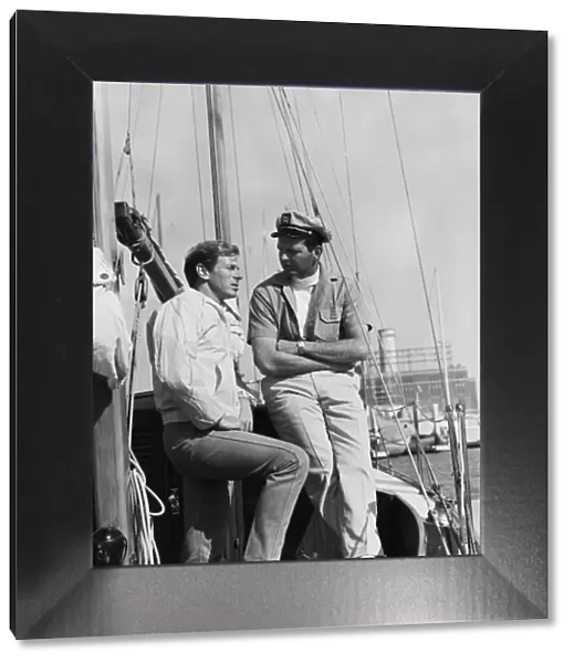 Two men standing in boat