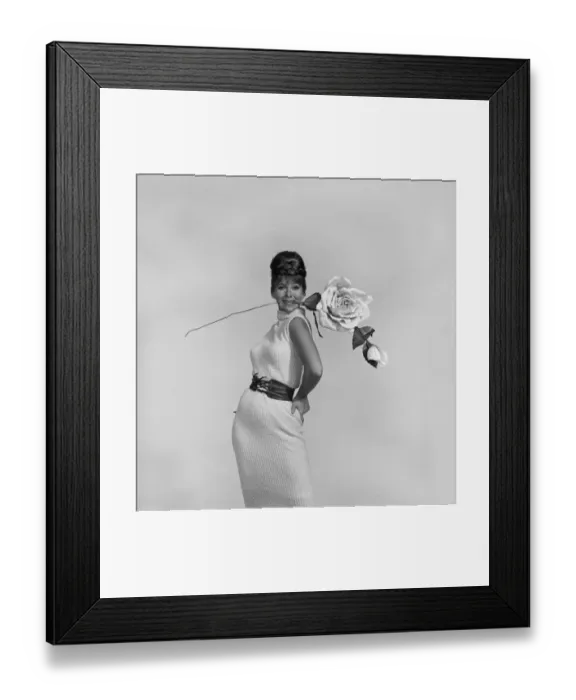 Framed Print : Woman posing with flower stem in mouth Framed Print : Woman posing with flower stem in mouth