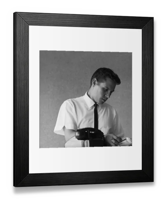 Framed Print : Businessman looking at telephone diary Framed Print : Businessman looking at telephone diary
