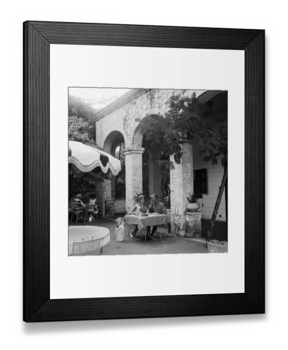Framed Print : Young couple sitting at outdoor cafA, smiling Framed Print : Young couple sitting at outdoor cafA, smiling