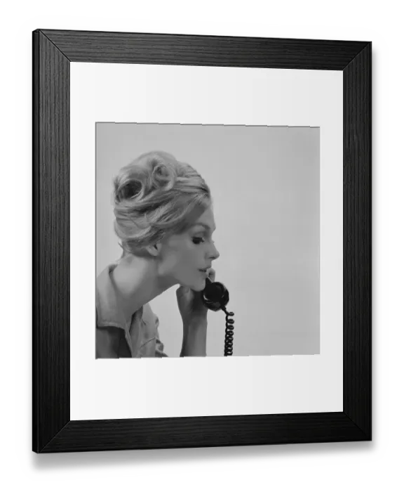 Framed Print : Young woman talking on phone, close-up Framed Print : Young woman talking on phone, close-up