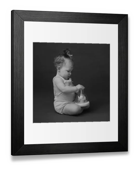 Framed Print : Baby girl playing with toy, close-up Framed Print : Baby girl playing with toy, close-up