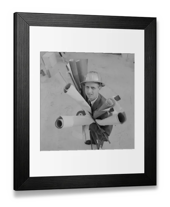 Framed Print : Engineer holding blueprints, portrait Framed Print : Engineer holding blueprints, portrait